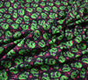 Polycotton Fabric - Scary Skulls Green