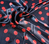 Red Spot on Black Silky Satin Fabric