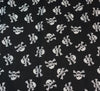 Polycotton Fabric - Skull & Crossbones (White on Black)