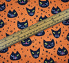 Polycotton Fabric - Creepy Cat Face Orange